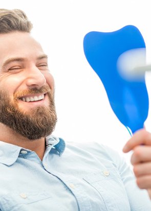 Man smiling after periodontal treatment